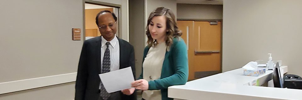 Doctors looking over paperwork