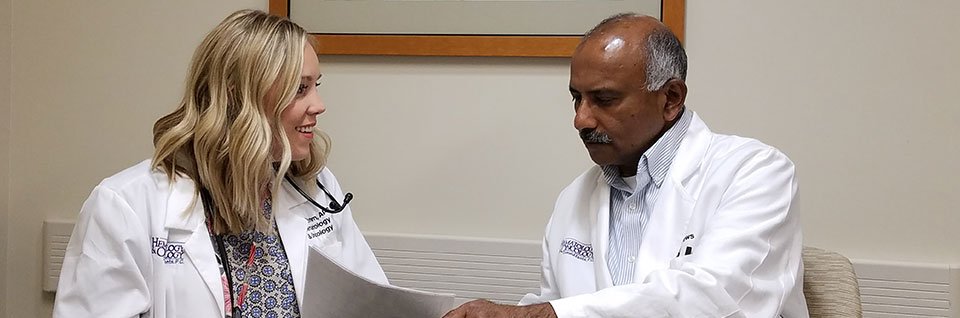 Doctors talking about paperwork